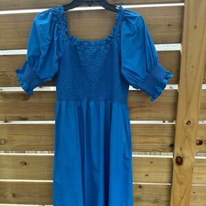 Never worn, just washed. Riyal blue smocked top sundress.  Has pockets